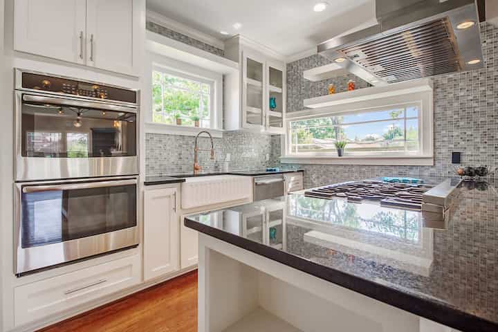 An image of a modern kitchen with sleek appliances, featuring a gas stove, refrigerator, and built-in microwave in Wichita Falls